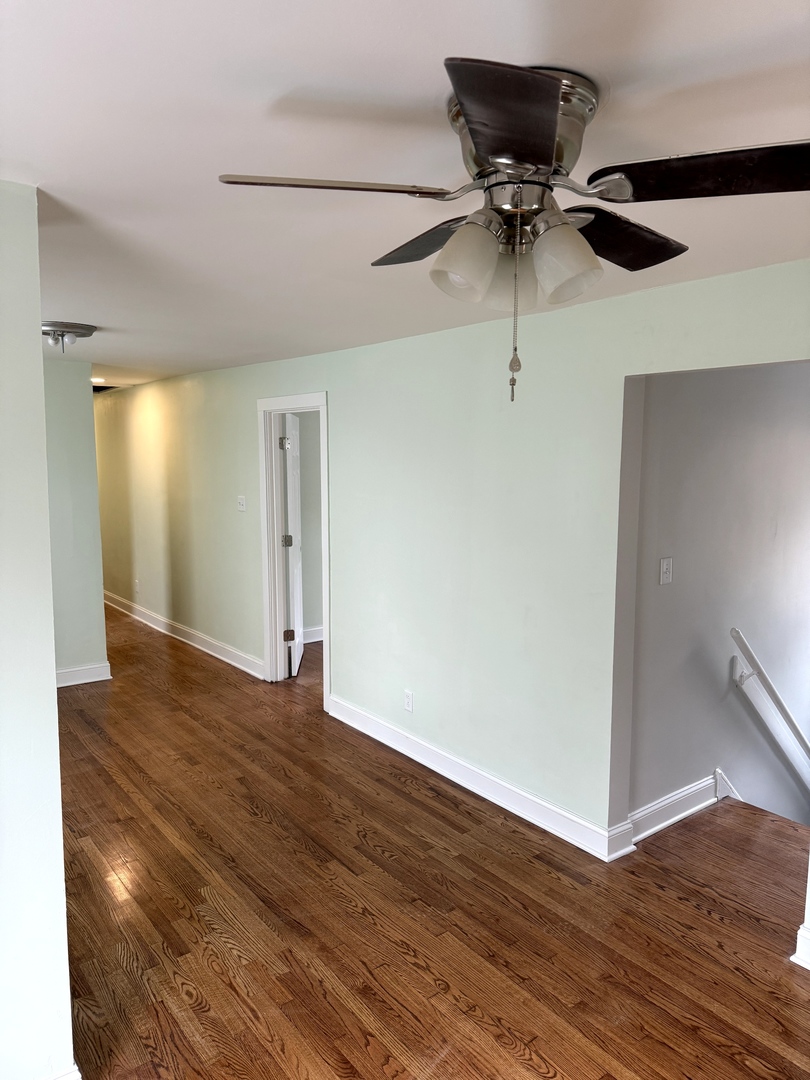 7744 South Champlain Avenue Chicago, IL 60619 - Photo 14 of 21 a view of a room with wooden floor