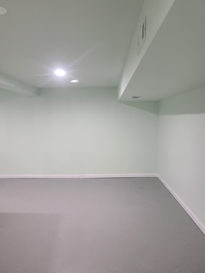 7744 South Champlain Avenue Chicago, IL 60619 - Photo 21 of 21 an empty room with a workbench