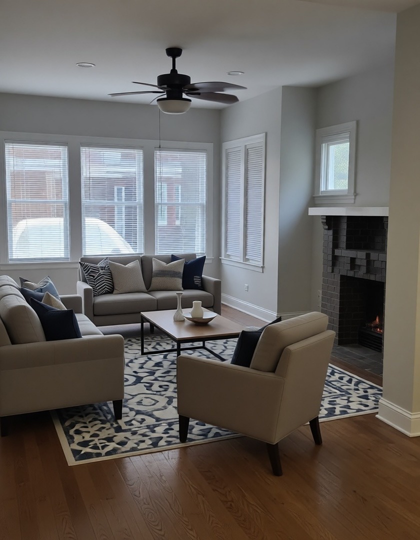 7744 South Champlain Avenue Chicago, IL 60619 - Photo 3 of 21 a living room with furniture wooden floor and a fireplace
