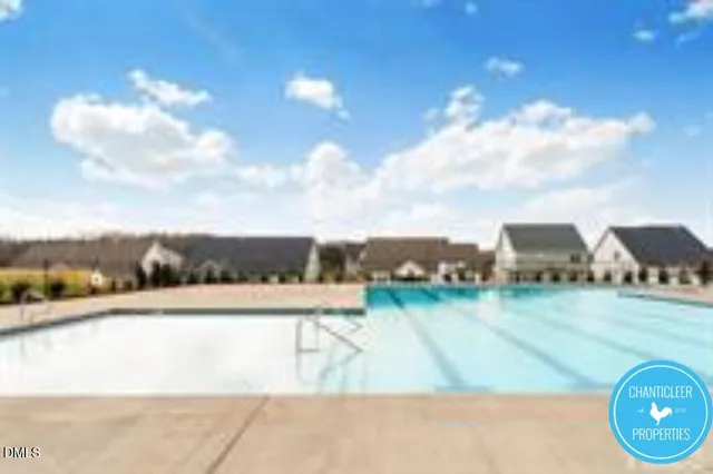 a sign that is sitting in front of a house