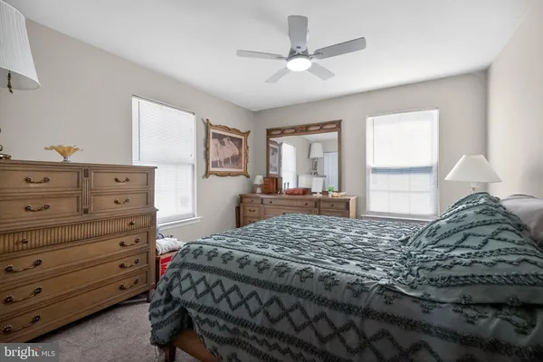 a bedroom with a bed and a dresser