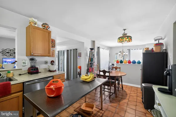 a kitchen with stainless steel appliances granite countertop a sink and a stove