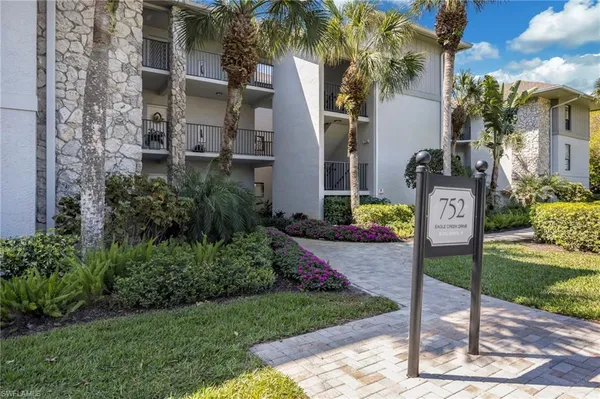 a sign board with yard in front of it