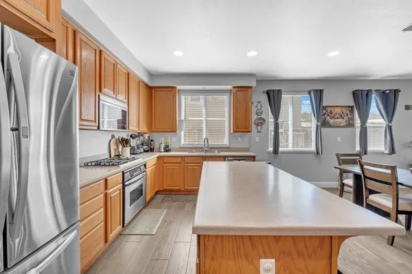 a view of kitchen with cabinets and wooden floor