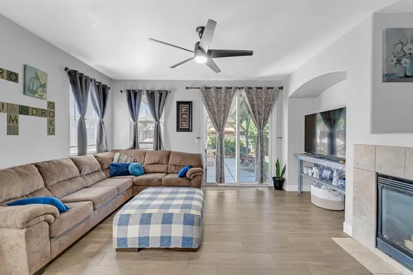 a living room with furniture and a large window