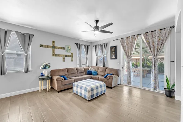 a living room with furniture and a large window