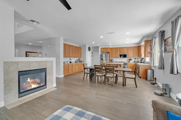 a view of a hallway with wooden floor and windows