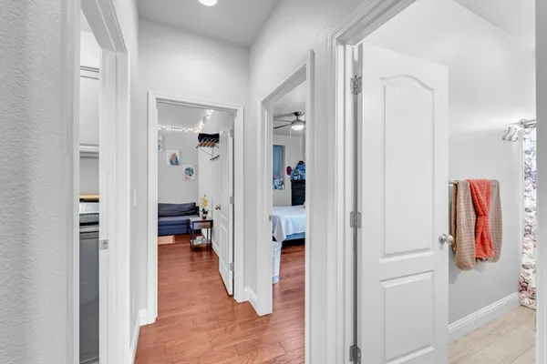 a bedroom with a bed and wooden floor