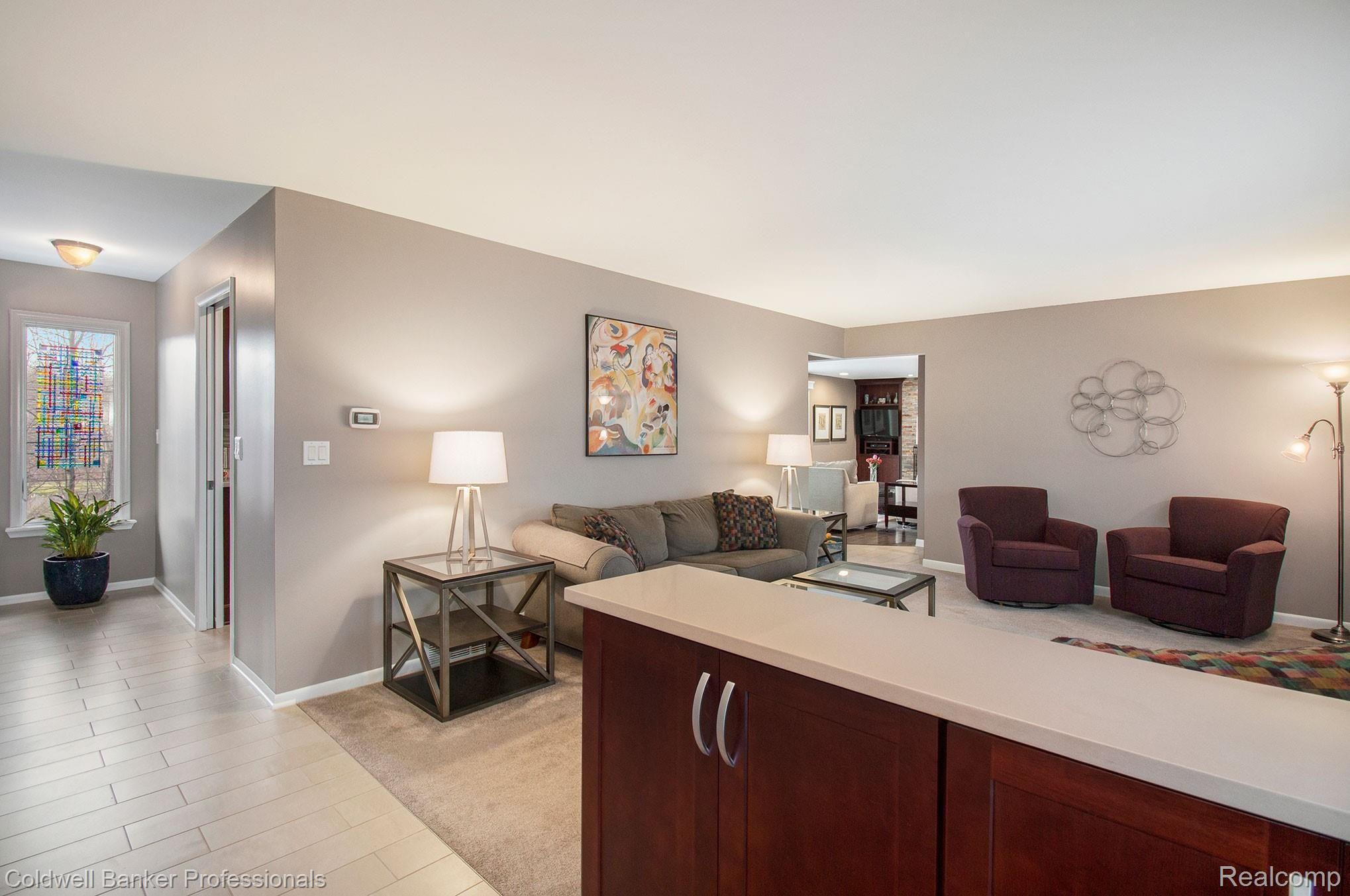Spacious living room leading to kitchen and family.  All floorings replaced on main level.