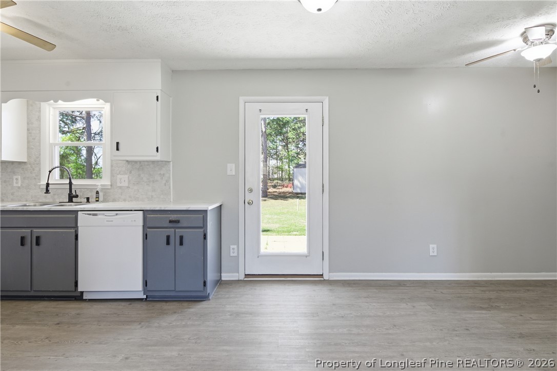 6319 Rustic Ridge Hope Mills, NC 28348 - Photo 11 of 39 a view of kitchen with granite countertop white cabinets and window