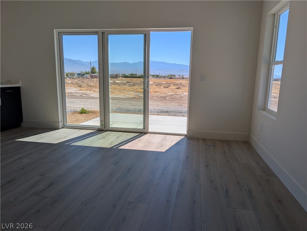 4670 Medicine Man Road Pahrump, NV 89048 - Photo 13 of 36 Sliding glass doors open to mountain vistas and an inviting outdoor space.