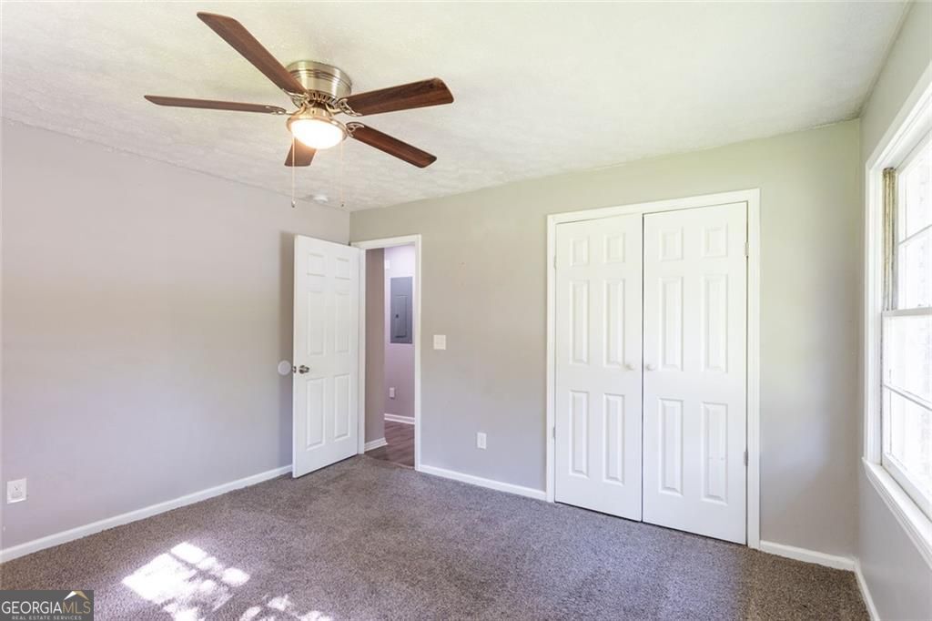 908 East Marable Street Monroe, GA 30656 - Photo 13 of 26 a view of an empty room with a window