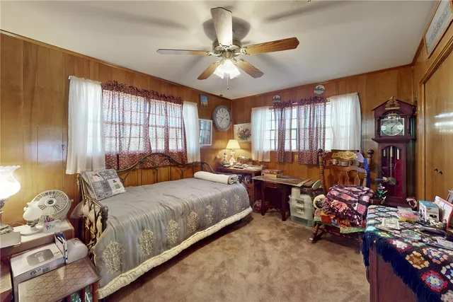 a bed room with a bed and a chandelier