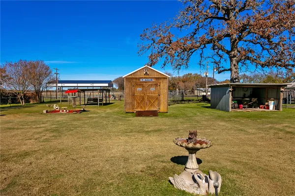 a sign board with yard in front of it