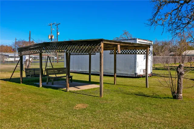 a living room with lots of furniture and a dining table