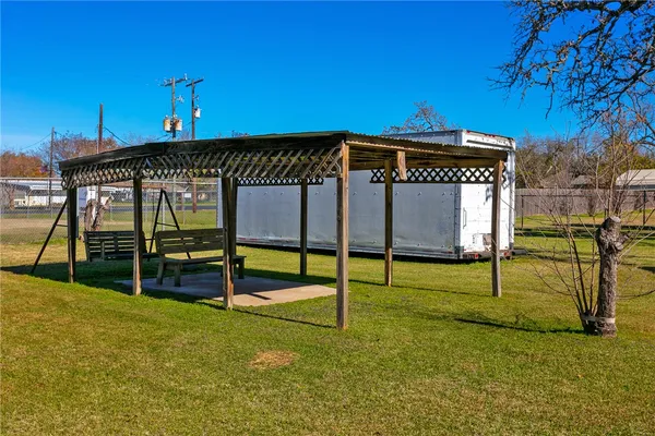 a living room with lots of furniture and a dining table