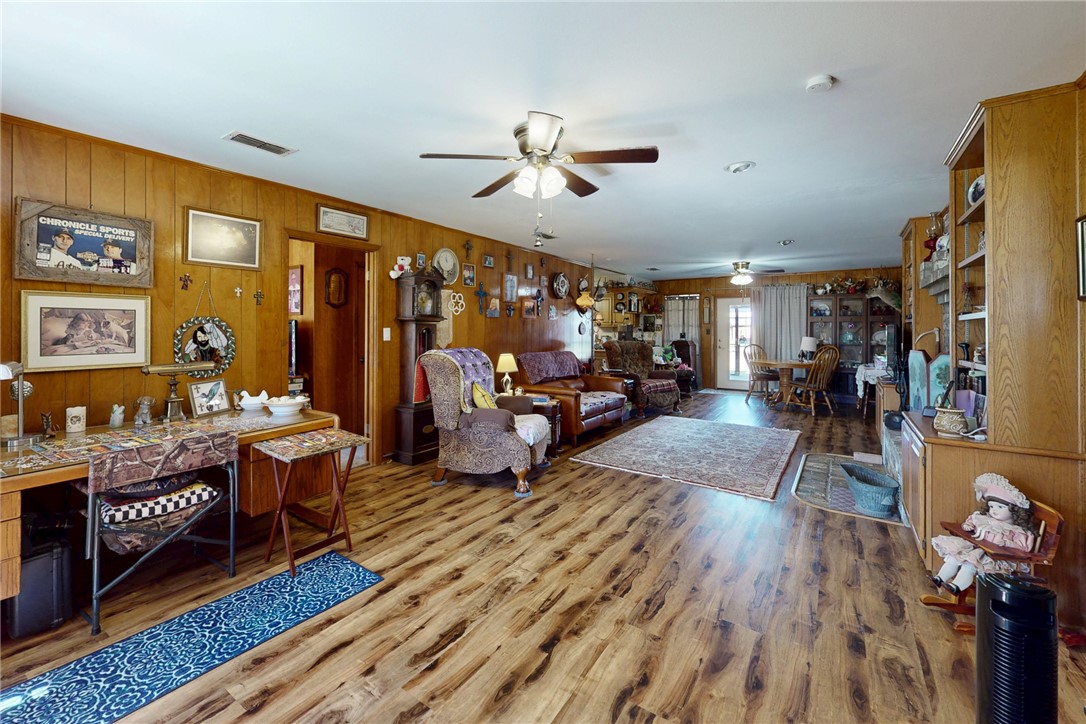 409 Morgan Street Franklin, TX 77856 - Photo 6 of 40 a living room with furniture and a wooden floor