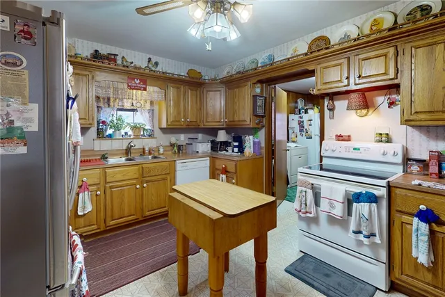 a kitchen with cabinets and wooden floor