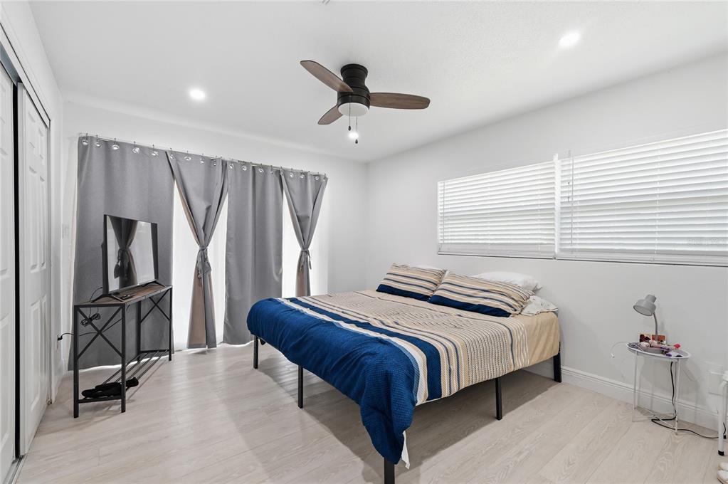 1946 Strathaven Road Winter Park, FL 32792 - Photo 17 of 37 a bedroom with a bed and a refrigerator