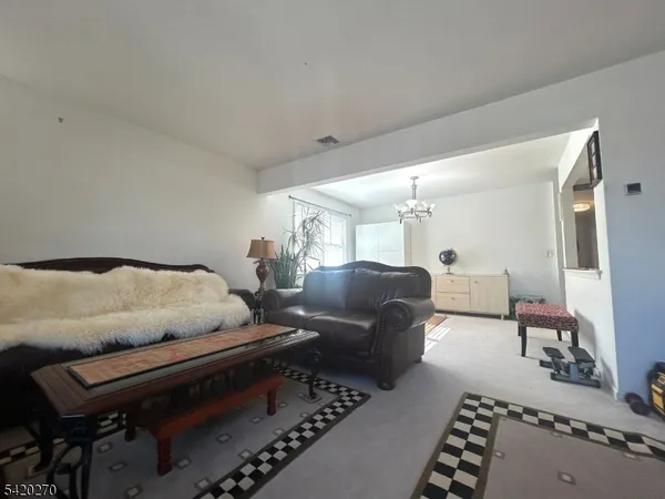 a bedroom with a bed and large window