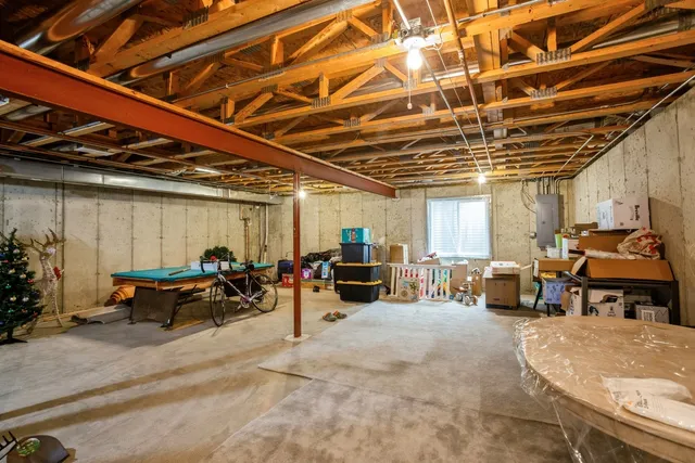 a front view of a house with a garden and plants