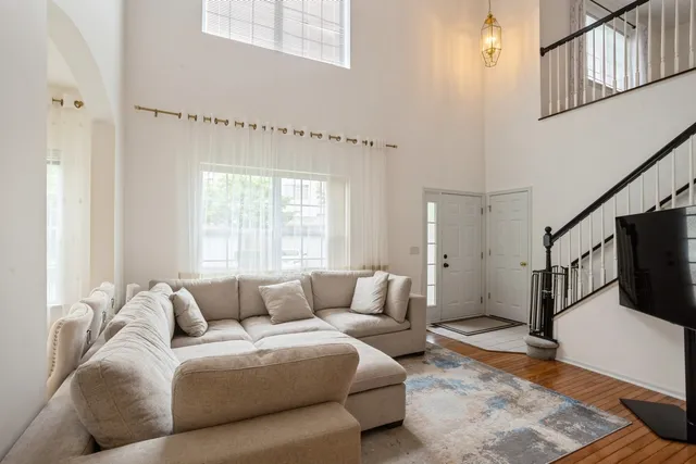 a kitchen with granite countertop a refrigerator stove and microwave