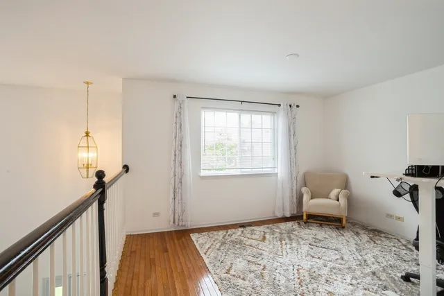 a bedroom with bed and window
