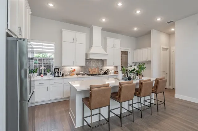 a view of hallway with wooden floor and stairs