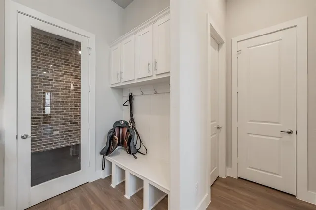 a living room with furniture a lamp and a window