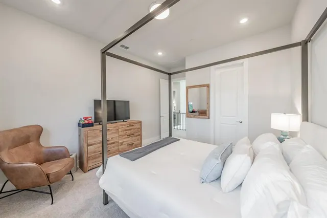 a bathroom with double vanity sinks and a mirror