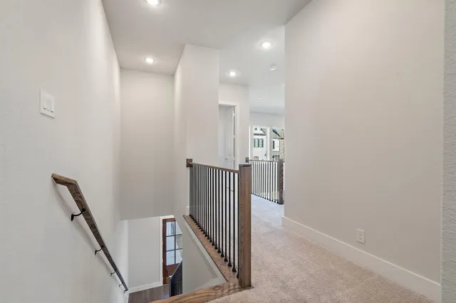 a view of a hallway with staircase