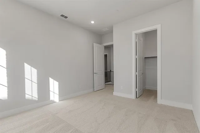 a view of an empty room and a window