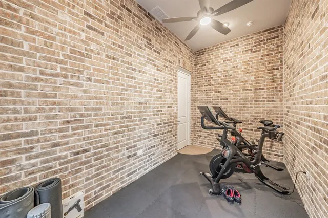 a view of a brick house with many windows