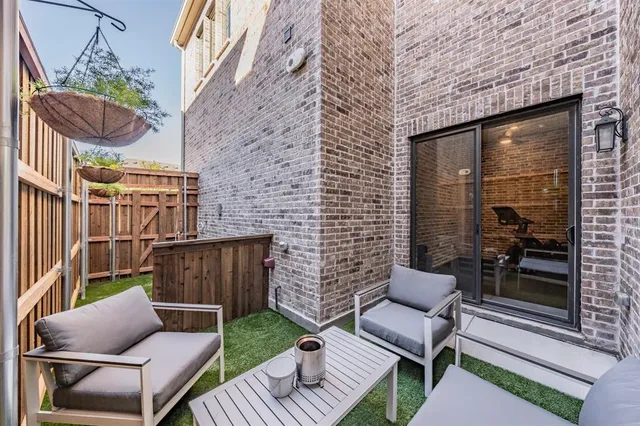 a front view of a residential apartment building with a yard