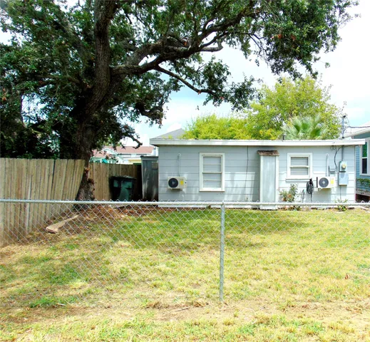 a garden with wooden fence