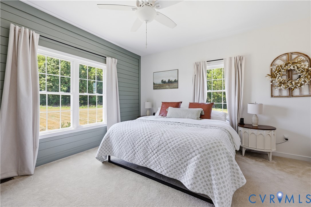 235 Stoney Point Road Cumberland, VA 23040 - Photo 24 of 35 a spacious bedroom with a bed and a window