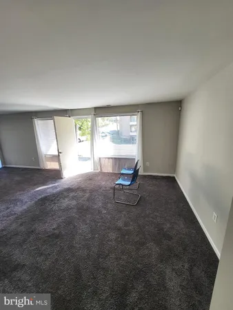 a room with a window and gym equipment