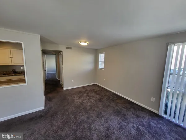 a view of a bathroom from a hallway