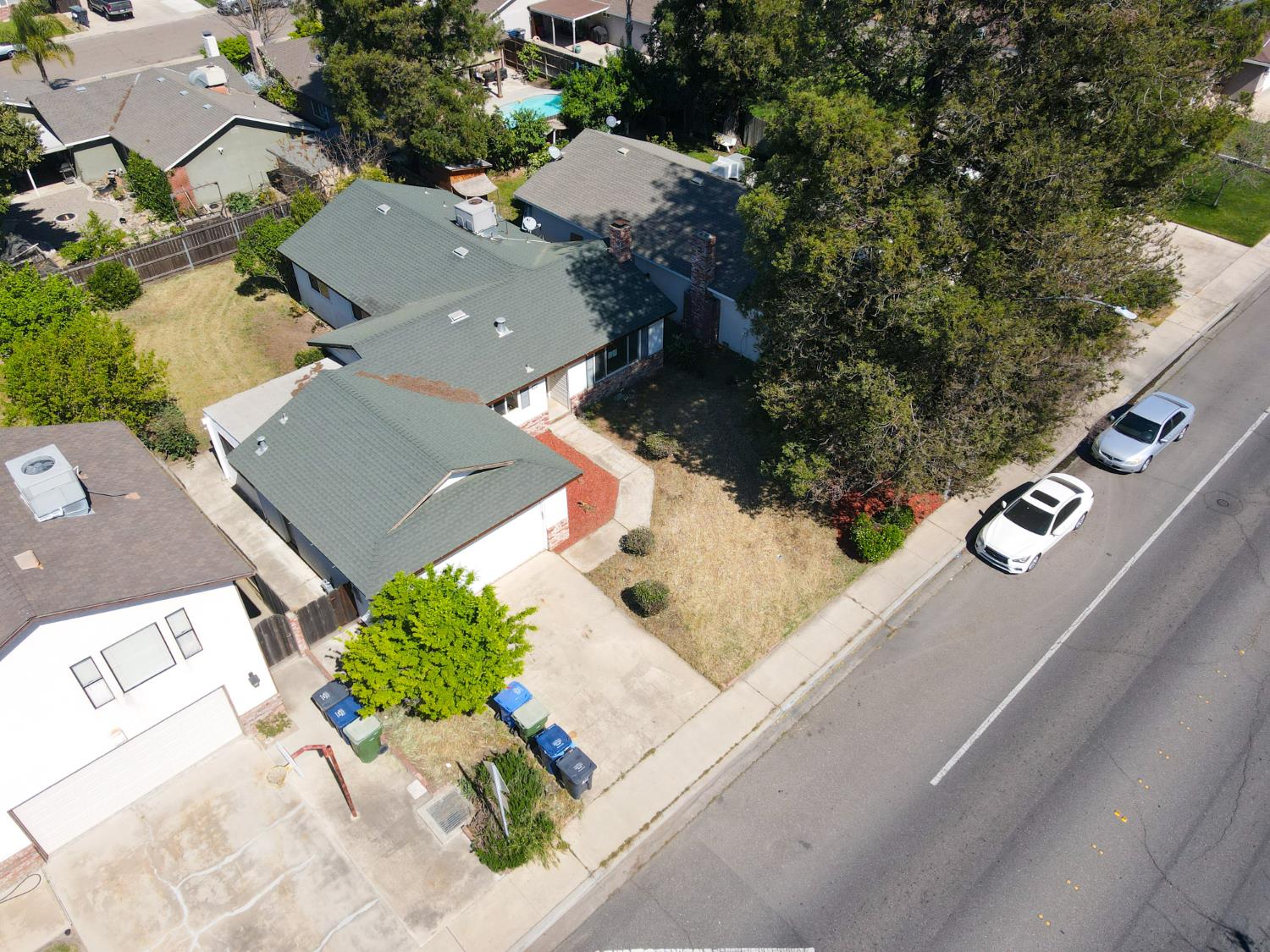 1465 West Tuolumne Road Turlock, CA 95382 - Photo 4 of 7 an aerial view of residential house with outdoor space