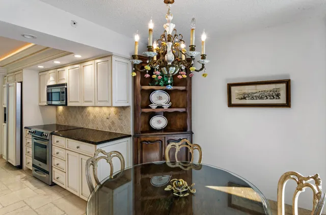 a kitchen with a table and chairs in it