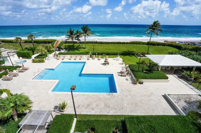 a view of a swimming pool with a patio