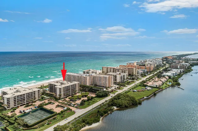 a view of a balcony with wooden floor and city view