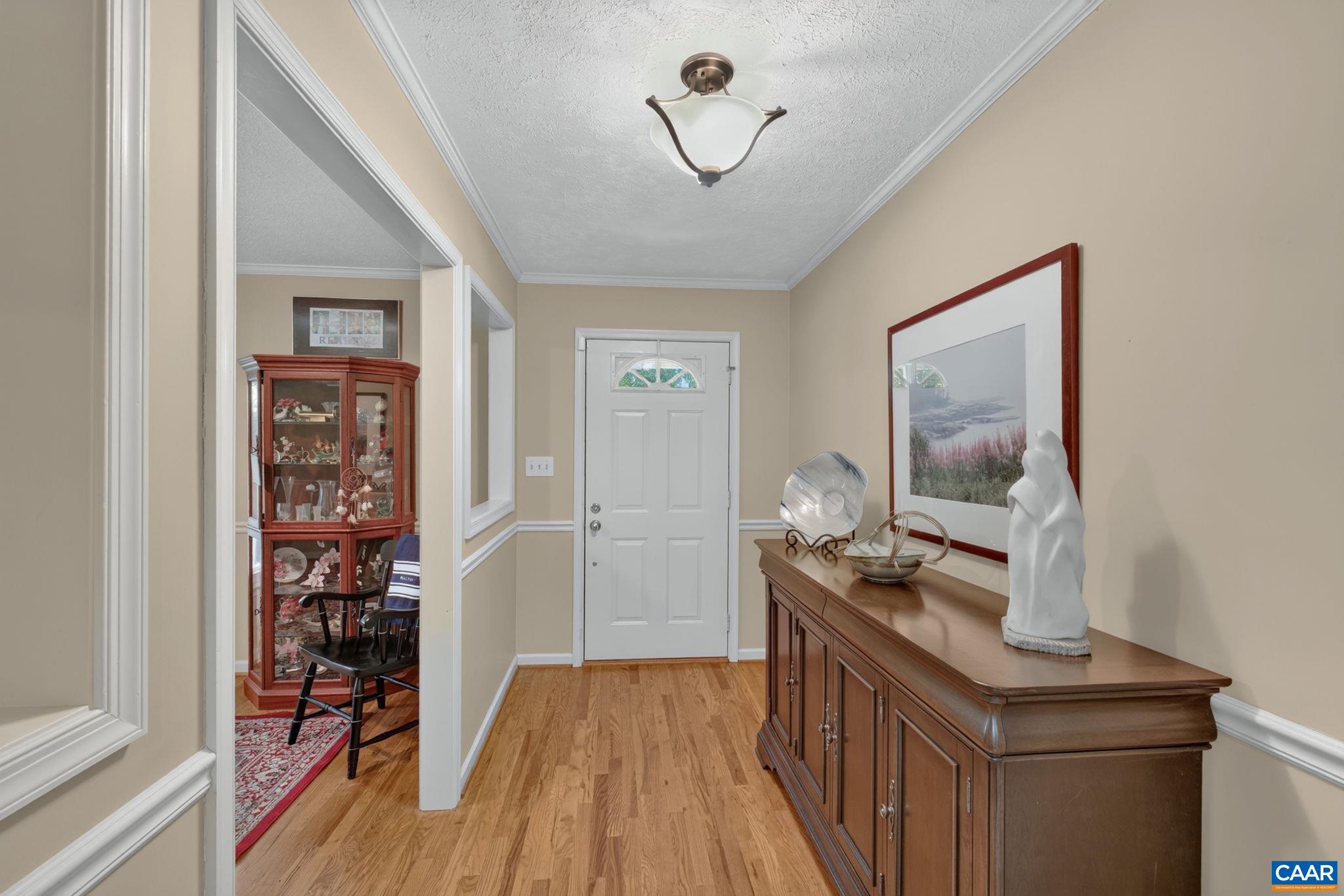 5363 Stony Point Road Barboursville, VA 22923 - Photo 14 of 66 Showing the foyer with Formal Dining Room, with cutouts to the foyer. The formal Dining Room is currently being used as a home office, although there are several other areas that could also be used for an office.