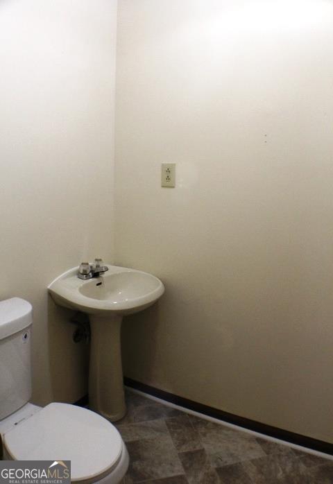 118 Whipoorwill Way Dublin, GA 31021 - Photo 12 of 28 a bathroom with a sink and a toilet