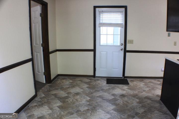 118 Whipoorwill Way Dublin, GA 31021 - Photo 17 of 28 an empty room with windows