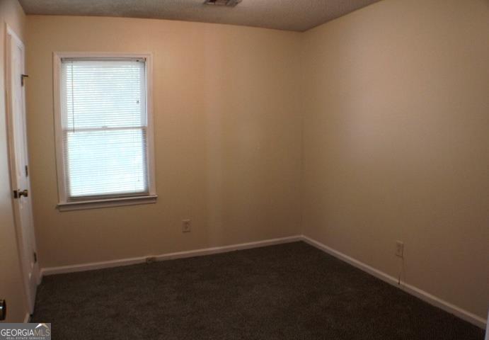 118 Whipoorwill Way Dublin, GA 31021 - Photo 21 of 28 an empty room with a window