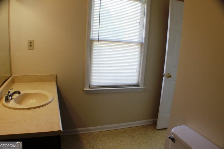 118 Whipoorwill Way Dublin, GA 31021 - Photo 25 of 28 a bathroom with a sink toilet and vanity