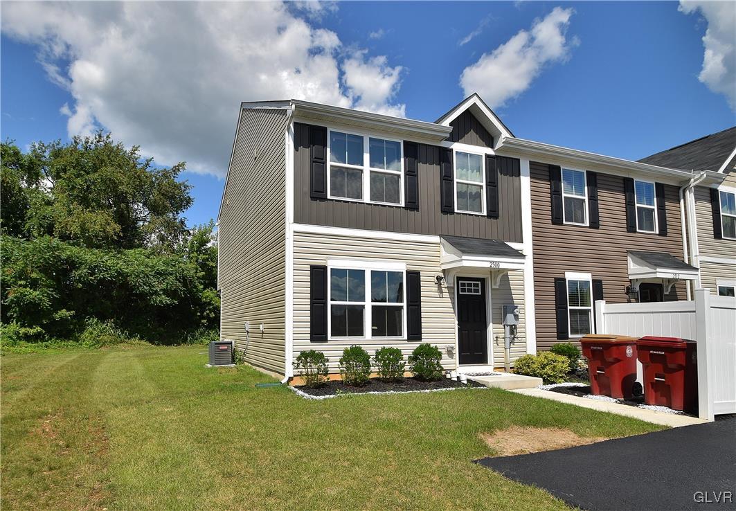 a front view of a house with a yard