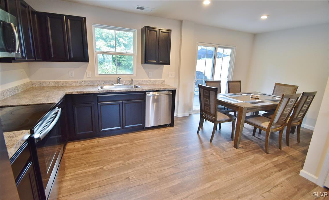2500 Alex Road Easton, PA 18040 - Photo 4 of 9 a kitchen with a table chairs sink and cabinets