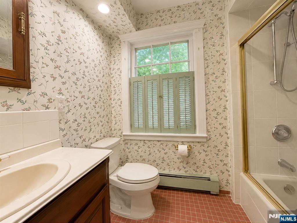 84 Valley View Avenue Ridgewood, NJ 07450 - Photo 12 of 20 a bathroom with a sink a toilet and shower